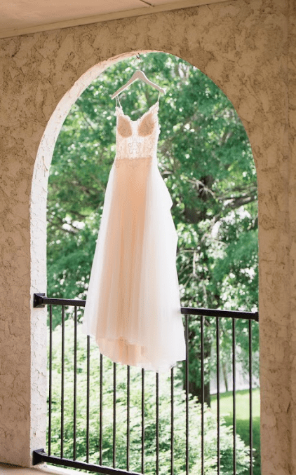 A beautiful dress from All About the Bride hanging in one of the archways of the TN River Place.