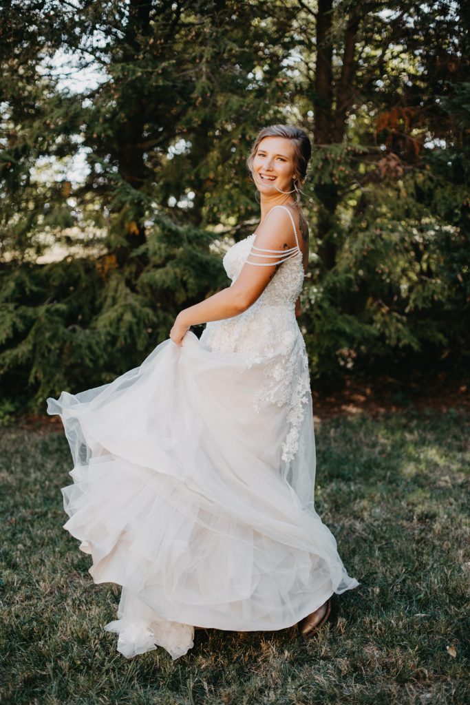 Bride twirls in her beautiful boho dress