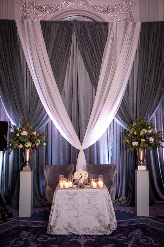 Elegant luxury draping for the sweet ehart table at the wedding