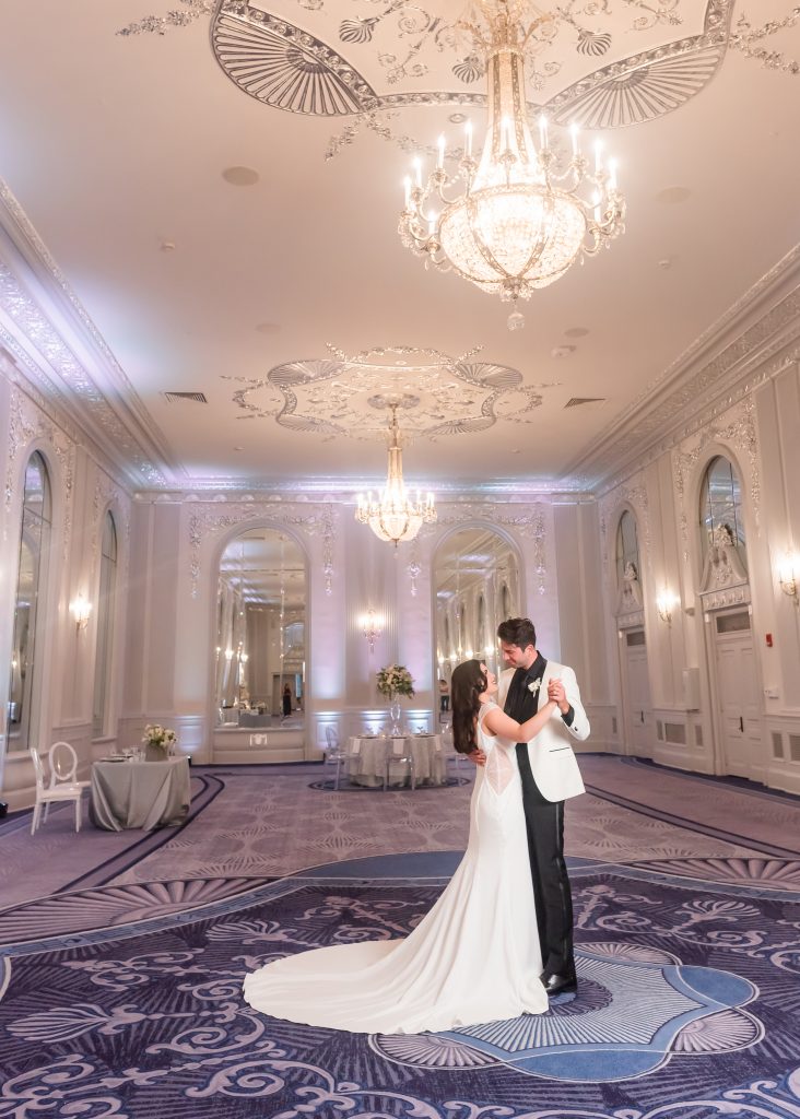 A bride and groom dancing in the silver ballroom of the historic southern venue, The Read House.